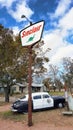 1950 Hudson Police Car next to Sinclair Oil Sign