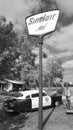 1950 Hudson Police Car next to Sinclair Oil Sign