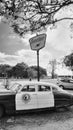 1950 Hudson Police Car next to Sinclair Oil Sign