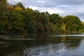 Hudson River in upstate New York in autumn colors. Vibrant colorful trees along the riverbank and some ducks swimming in the water Royalty Free Stock Photo