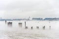 Hudson river in Winter with Misty Edgewater Cityscape in Background.