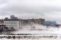 Hudson river in Winter with Misty Edgewater Cityscape in Background.