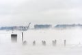 Hudson river in Winter with Misty Edgewater Cityscape in Background.