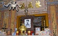Close up of altar with souvenirs and portrait of former vietnamese emperor