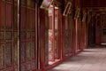 Hue, ancient capital of Vietnam. Red doors gallery in Forbidden Purple City. Royalty Free Stock Photo