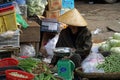 Hue, vietnam, circa january 2020: locals sellings their products on a market Royalty Free Stock Photo