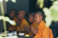 Hue, Vietnam - June 2019: Buddhist monks saying traditional prayer chants before meal in Thien Mu Pagoda