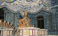 Beautiful mosaic tiled hall with throne and golden sculpture of vietnamese emperor
