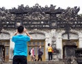 Tourist taking pictures on the grounds of Khai Ding Tomb, one of Imperial Tombs of Hue