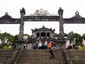 Tourists taking pictures at the entrance to Khai Ding Tomb, one of Imperial Tombs of Hue