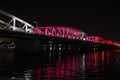 The colorfully lit Truong Tien bridge rising above the Perfume river in the Vietnamese city of Hue at