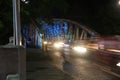 Speeding traffic on the colorful Truong Tien bridge in the Vietnamese city of Hue. (blur due to motion