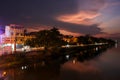 A twilight cityscape of the Vietnamese city of Hue rising above the Perfume river