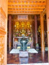 Hue, Vietnam - September 13 2017: Beautiful golden statues inside of a beautiful temple with gorgeous ornates details in