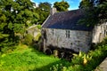 Watermill of Huelgoat, an old and typical water mill in Brittany France Royalty Free Stock Photo