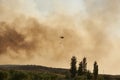 Huelva, Bonares, Spain August 05 2023: Infoca helicopter, Firefighters, prepares the trajectory to pour water on the forest fire