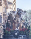 Huelva, Spain - April 15, 2022: Throne or platform of Descendimiento descent in procession by the narrow streets of the city.