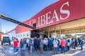 A group of people visiting a modern olive oil mill. Extra virgin olive oil factory brand Olibeas