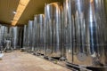 Tanks with produced oil inside of an olive oil mill. Extra virgin olive oil factory brand