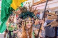 Beautiful young woman dressed and made up in exotic period costume in the parade of Medieval