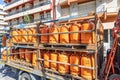 Huelva, Spain - May 10, 2022: A truck delivering orange butane bottles from the Repsol company Royalty Free Stock Photo