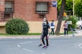 Huelva, Spain - May 5, 2020: Woman going out for a walk wearing protective or medical face masks during the alarm state and