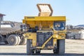 Huelva, Spain - November 13, 2021: Komatsu Mining trucks in Corta Atalaya open mine pit. Deep excavation of pyrite and extraction