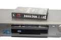 VHS movie cassette of Jurassic Park on an old Sony video recorder isolated on a white background Royalty Free Stock Photo