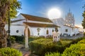 Huelva, Spain - September 8, 2020: View of Sanctuary Virgen de la Cinta from Gardens, backlighted with sun flares, patron virgin