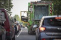 Huerth, NRW, Germany, 06 09 2021, Garbage trucks are blocking the passage in a street, cars are waiting behind it