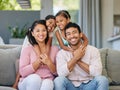 Hug, asian family portrait and happy kids on sofa in living room for care, happiness and bonding. Love, parents and girl Royalty Free Stock Photo