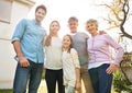 Hug, backyard portrait and happy family grandparents, parents and kid bonding, smile and spending outdoor time together