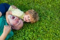 Hug and embrace - grandfather and grandson. Happy child with Grandfather playing outdoors.