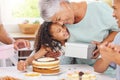 Hug, happy and gift giving of a grandmother and girl with birthday cake at a party celebration. Happiness of people at a