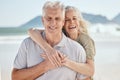 Hug, love and senior couple at the beach on a romantic vacation, adventure or weekend trip. Happy, smile and portrait of Royalty Free Stock Photo