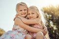 Hug, nature and portrait of girl siblings bonding, hugging and playing together in a park. Happy, smile and sisters Royalty Free Stock Photo