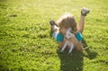 Hug new friends. Child boy took puppy from shelter. Adopted animal. Small cute pet finds home. Puppy gratefully licks a Royalty Free Stock Photo