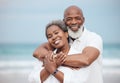 Hug, portrait and a senior couple at the beach for a vacation, retirement travel and walking. Smile, love and an elderly Royalty Free Stock Photo