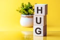 HUG - words from wooden blocks, Front view Royalty Free Stock Photo