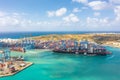 Huge APL cargo ship for transporting containers in port at unloading. Malta, Il Brolli Marsaxlokk, Malta-Freeport. 05 may 2019 Royalty Free Stock Photo