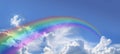 Huge arcing rainbow on wide blue sky Royalty Free Stock Photo