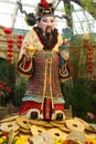 Huge Asian figure with huge gold coins