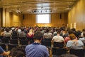 Huge audience listening to a scientific presentation in an European conference