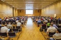 Huge audience paying attention to a scientific presentation in an European conference