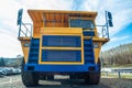 Huge auto-dump yellow mining truck