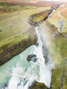 Vertical photo of Gullfoss waterfall in autumn time of the year, vibrant green hills surrounding the waterfall Royalty Free Stock Photo