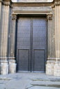 Huge black wooden doors of church in Barcelona Royalty Free Stock Photo