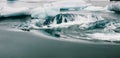 Huge blocks of ice on Glacial river and blue icebergs on Jokulsarlon glacier lake. Vatnajokull National Park, Iceland