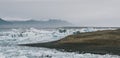 Huge blocks of ice on Glacial river and blue icebergs on Jokulsarlon glacier lake. Vatnajokull National Park, Iceland