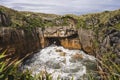 Huge blowhole in famous Pancake Rocks, Punakaiki, New Zealand